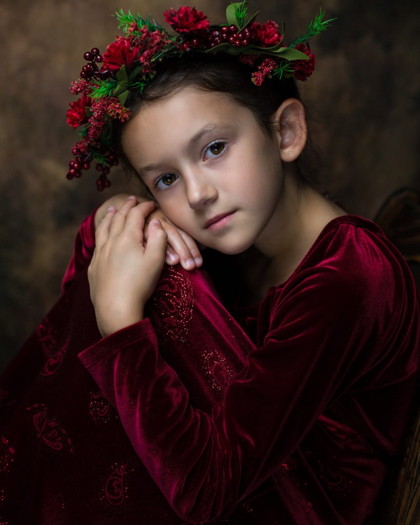 fine art portrait of a 8 year old girl traditional red dress and wreath ideas for posing in Farmington CT