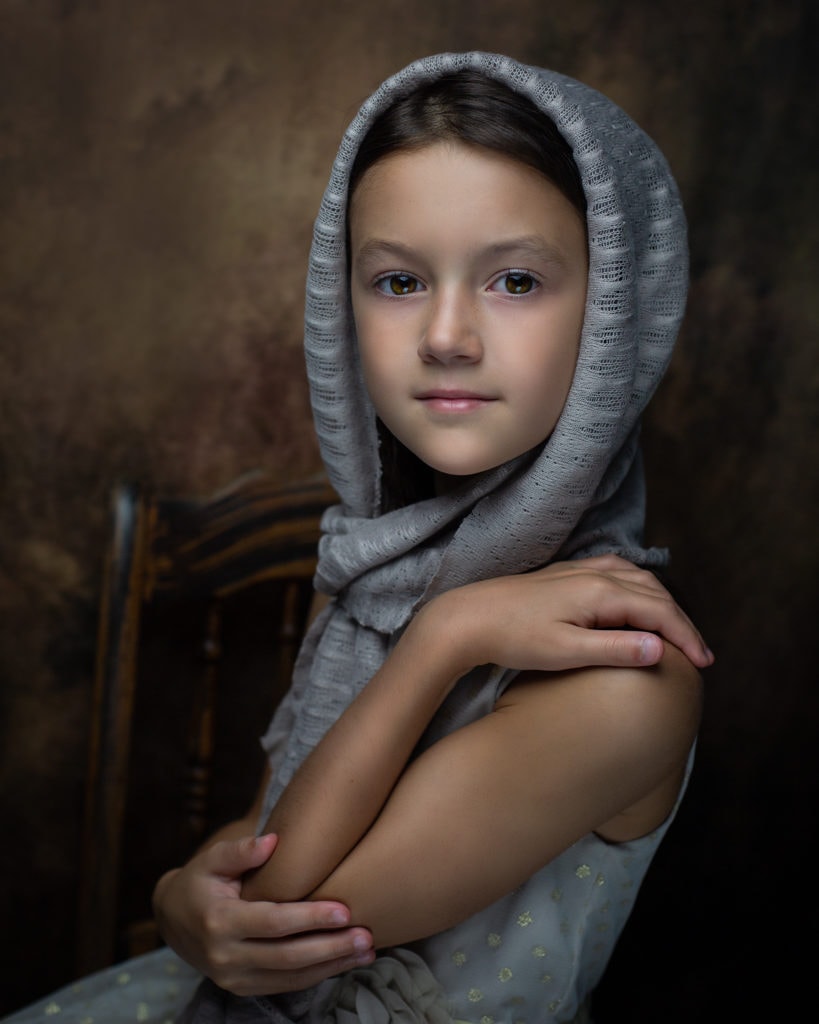 fine art portrait of a 8 year old girl traditional cream dress ideas for posing in Farmington CT