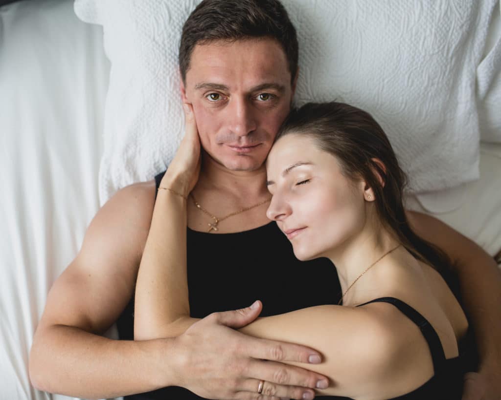 stunning couple's photoshoot in a bedroom