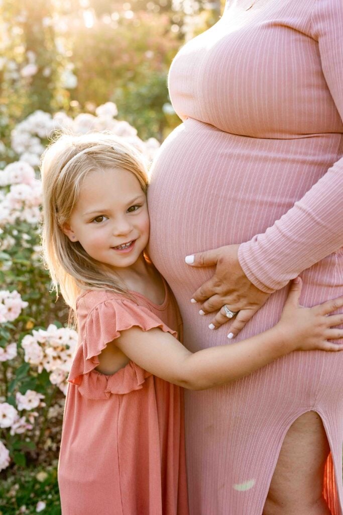 Elizabeth park rose garden maternity photoshoot with older daughter