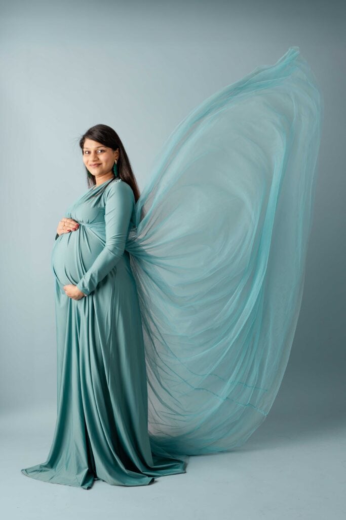 studio maternity session in teal dress Farmington CT