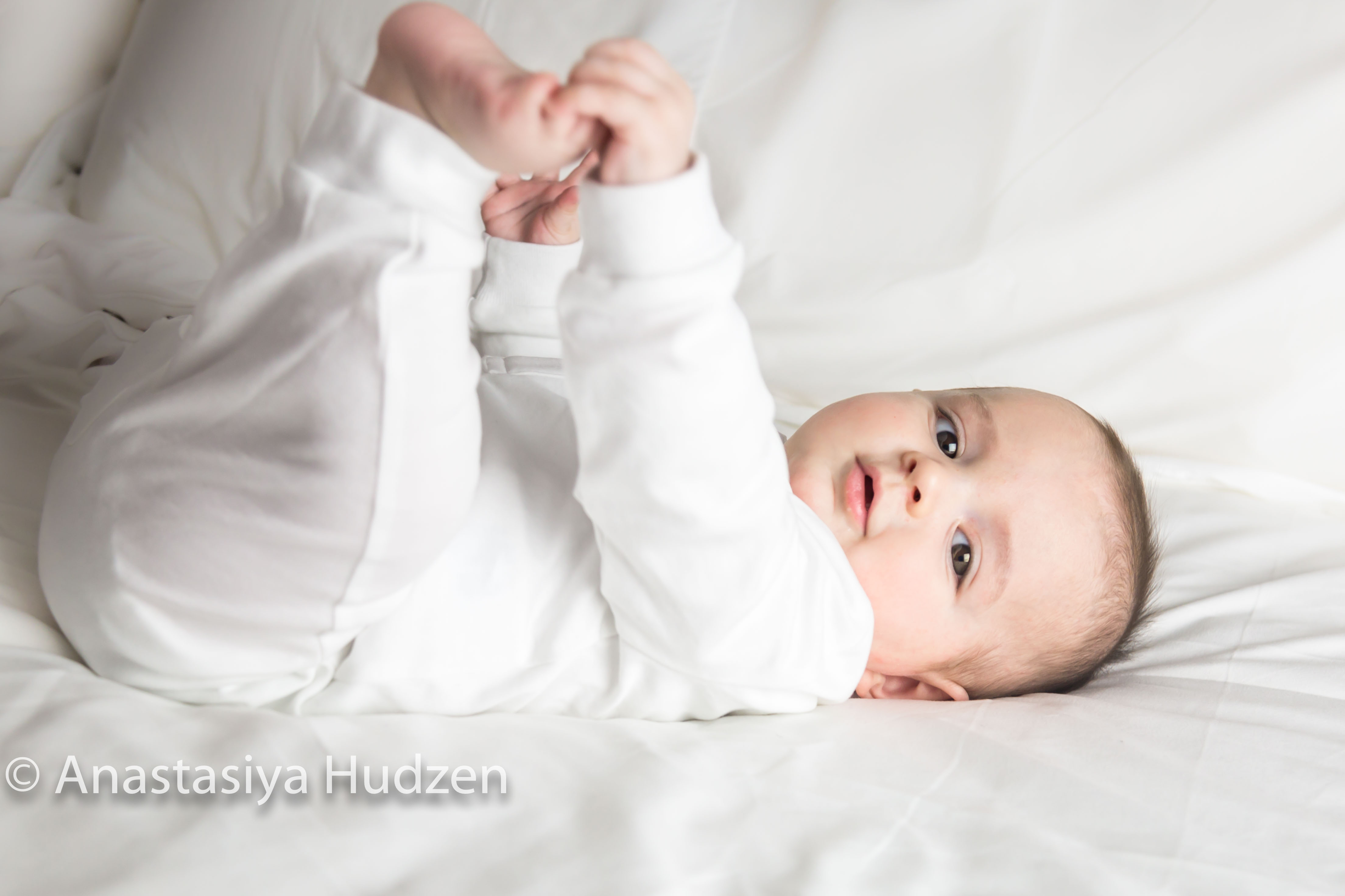 newborn baby boy photography Portuguese Farmington ct holding feet in white