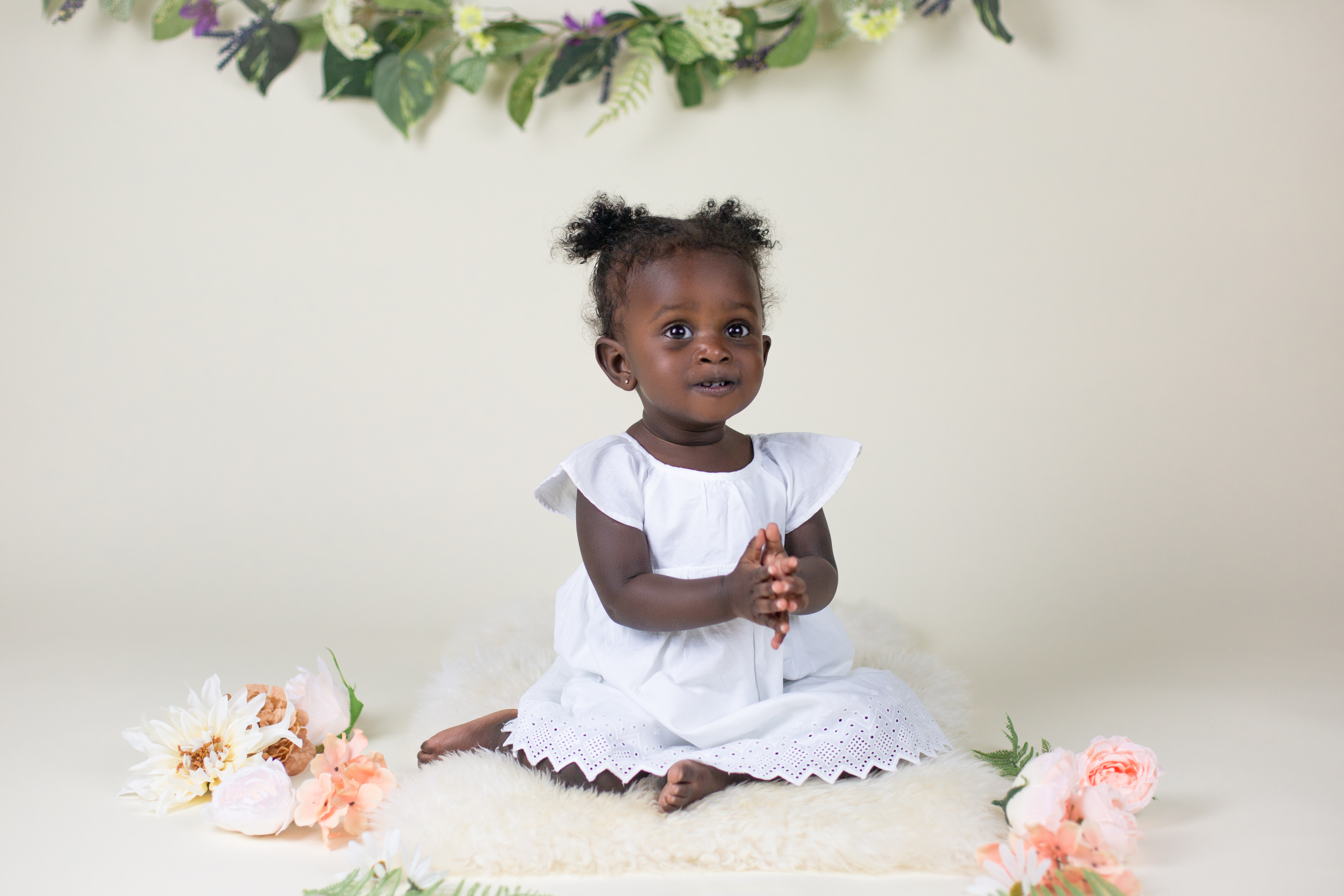 cake smash black African American baby girl in white farmington ct flowers bone savage backdrop