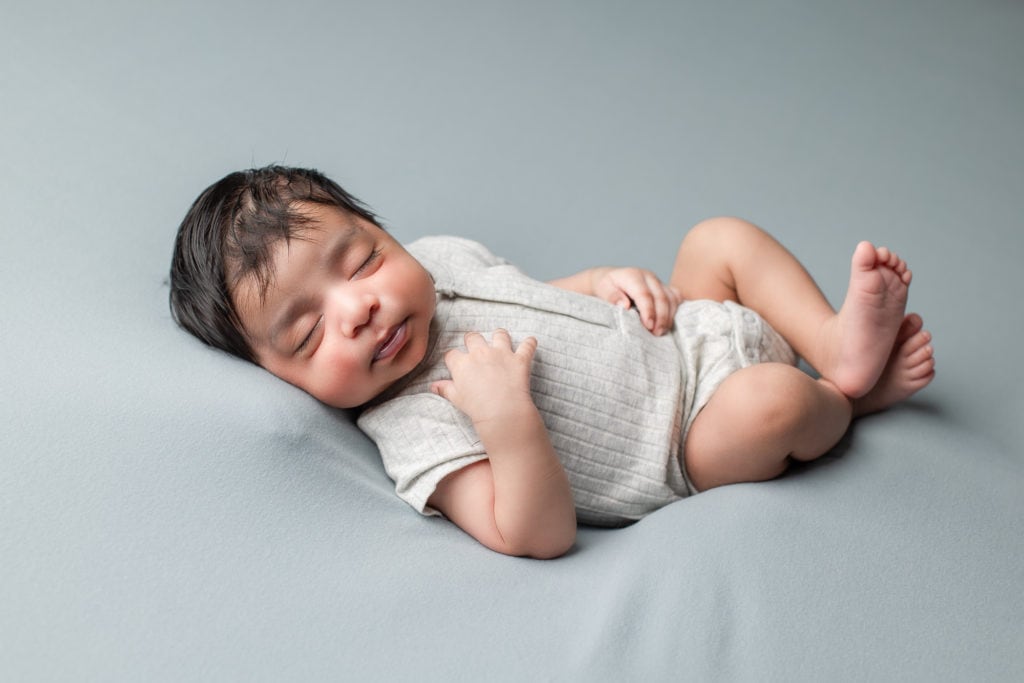 Hairy Indian newborn baby boy gentle posing