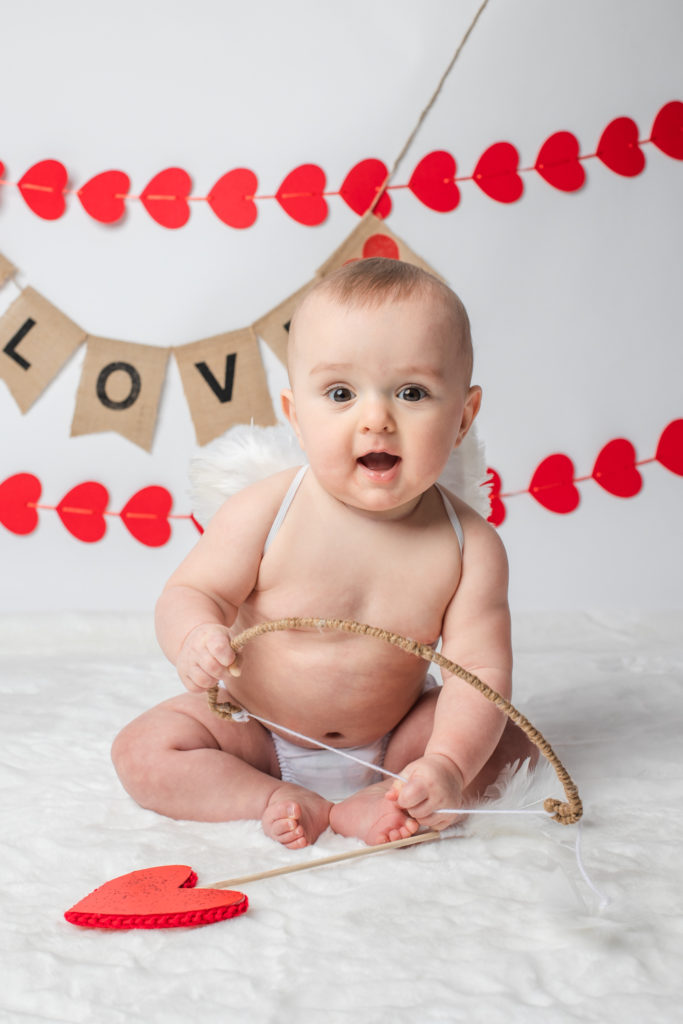 valentine mini session baby cupid with hearts and bow milestone 6 months Farmington ct