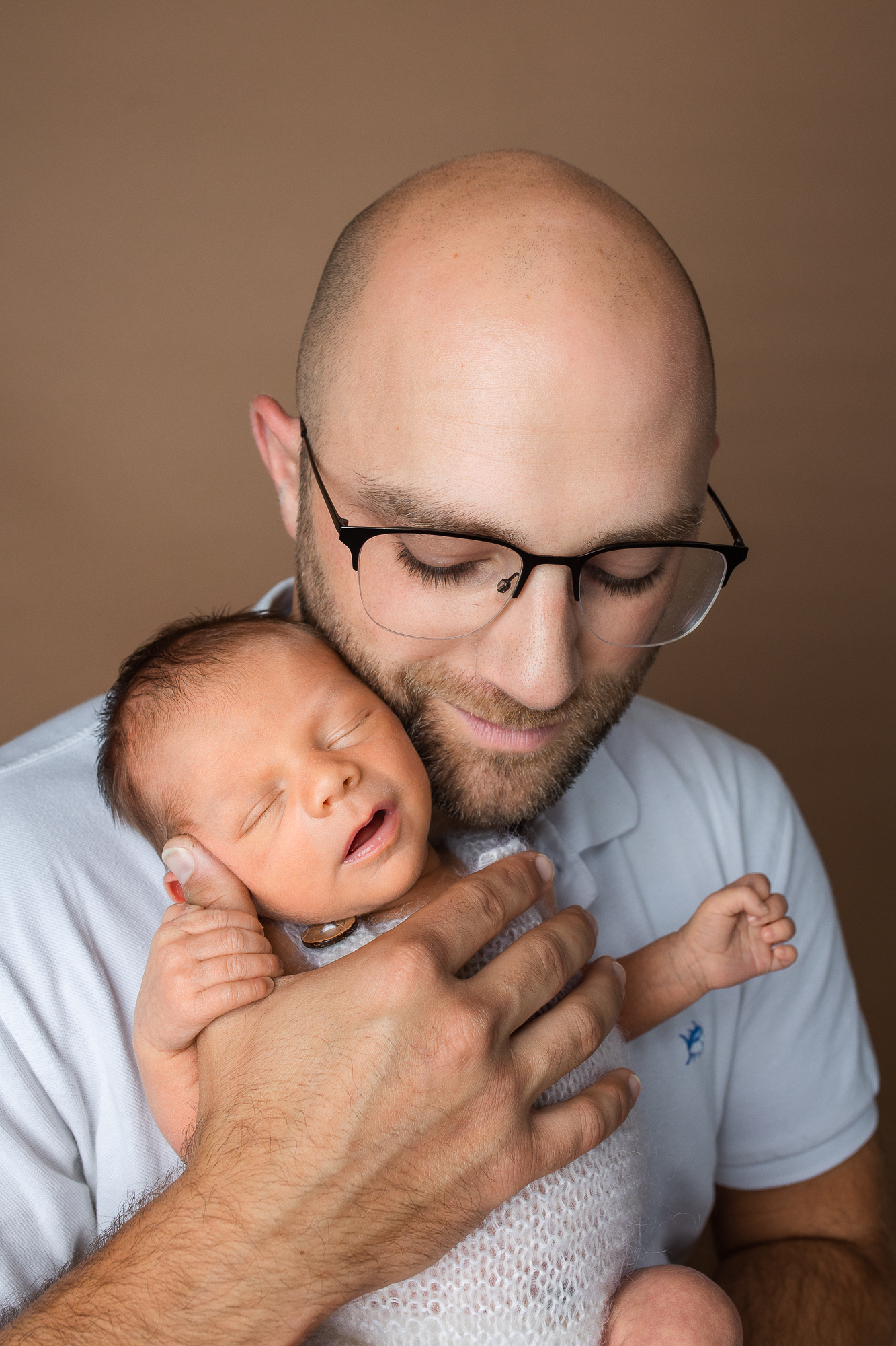 dad and newborn baby boy posing