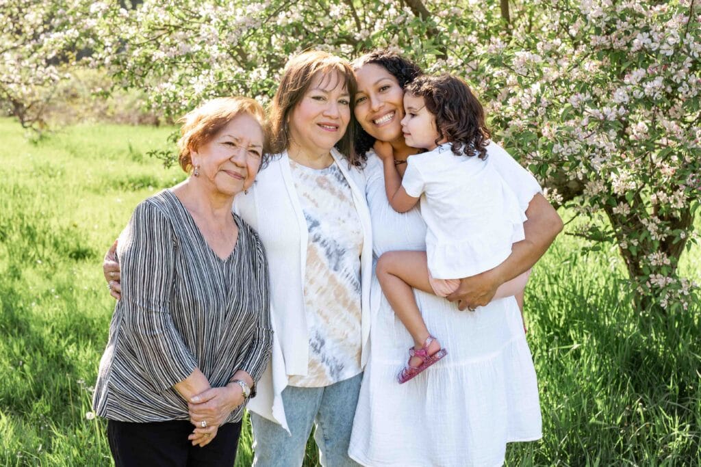 spring mini sessions in orchard with 4 generations of women