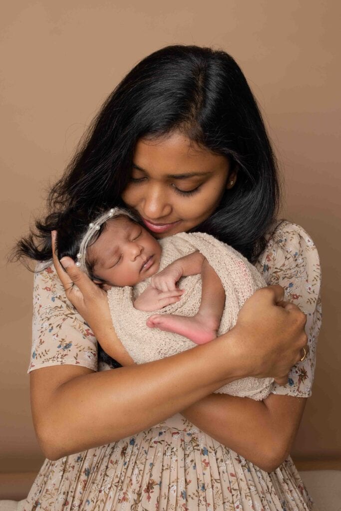 indian mom and baby in a newborn photoshoot done by newborn photographer in Farmington CT